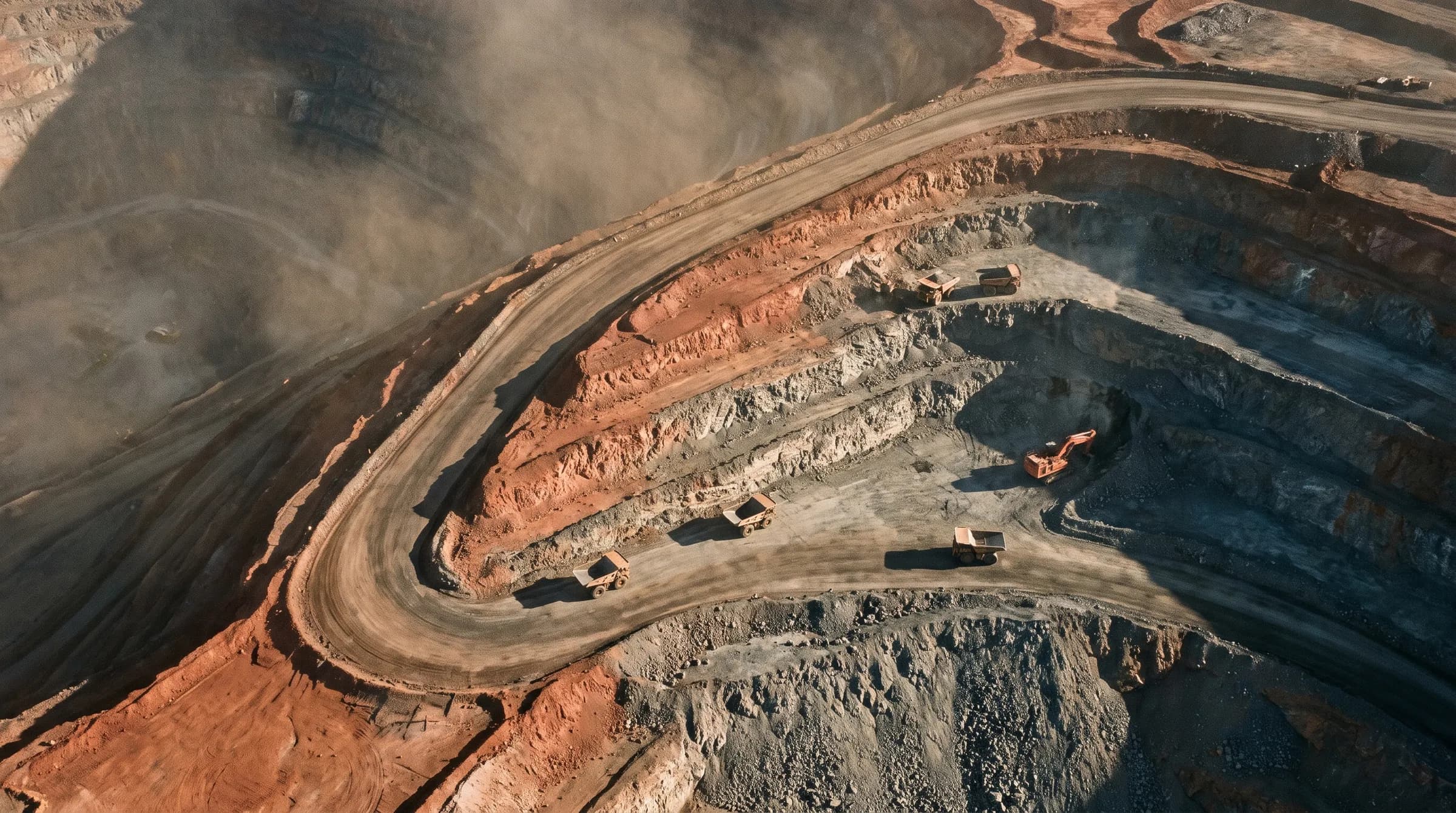 An open-cut mine bench and haul road photographed from the air