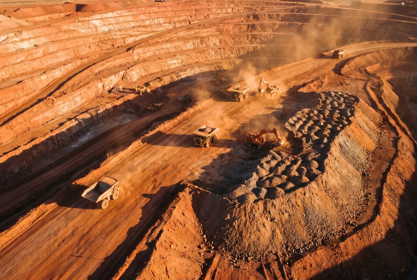 An open-cut mining operation photographed from the air at dawn